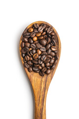 Obraz premium Roasted coffee beans on wooden spoon