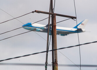 View of the presidential plane of the united states of america soaring through the sky from a roof...