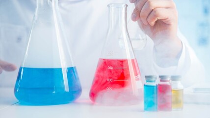 Funny mad chemist working in a laboratory