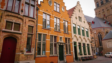 Bruges, Belgium - May 12, 2018:  Roofs And Windows Of Old Authentic Brick Houses On Street Sint-Jakobsstraat