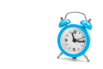 Classic retro blue alarm clock on isolated white background