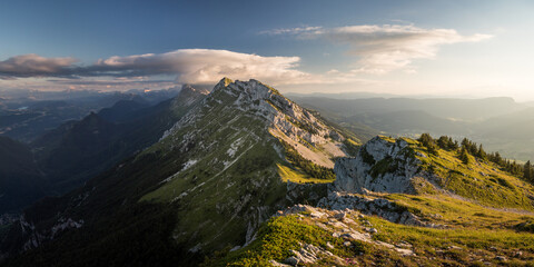 Panoramic view of vercors mountain range with clouds and sunset in summer