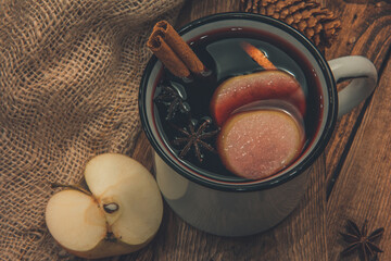 Mulled wine or gluhwein in a white retro mug with spices