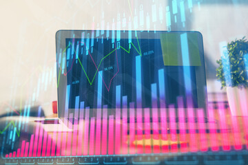 Forex market chart hologram and personal computer background. Multi exposure. Concept of investment.