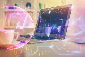 Financial graph colorful drawing and table with computer on background. Double exposure. Concept of international markets.