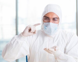 Fototapeta premium Young chemist student working in lab on chemicals