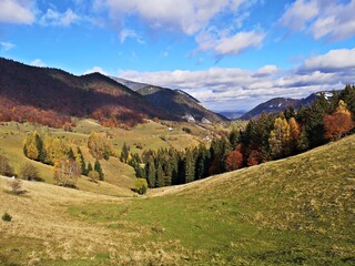 Naklejka na ściany i meble Amazing mountains landscape during fall season. Small village in the mountains. Rural landscape.