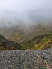 fog in the mountains
Distant waterfall 
New Zealand 
Kepler