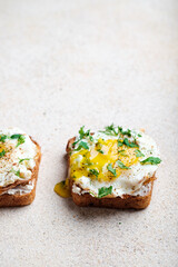 Toast with cheese, egg and herbs