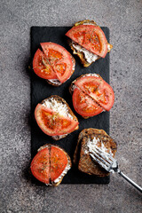 Croutons with cheese and tomato