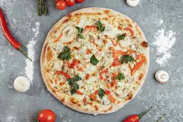 Chicken-blue pizza with tomato, mozzarella and Dor Blue cheeses on gray background