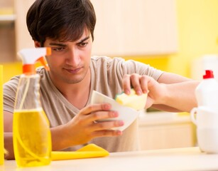 Man washing dishes at home