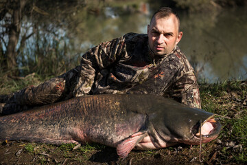 Fisherman with catfish