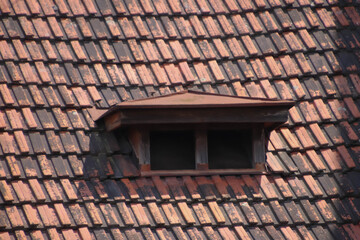 Small window on a roof top.
