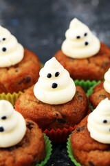 halloween cupcake and pumpkin on a dark background. sweets with cupcakes for the celebration of spooky Halloween.