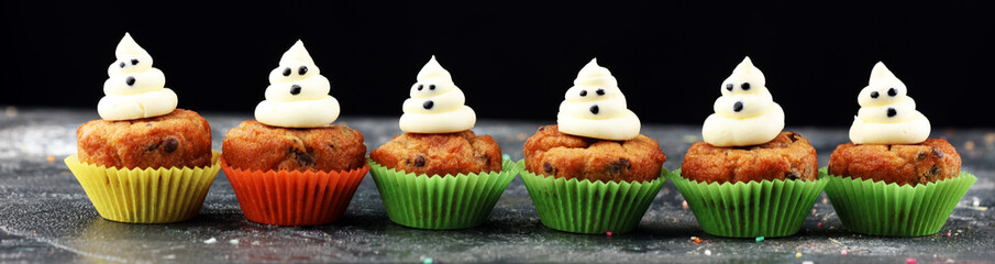 halloween cupcake and pumpkin on a dark background. sweets with cupcakes for the celebration of spooky Halloween.