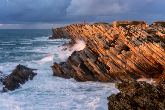 Cliffs beatiful rock details in Baleal Island with atlantic ocean crashing waves in Peniche, Portugal