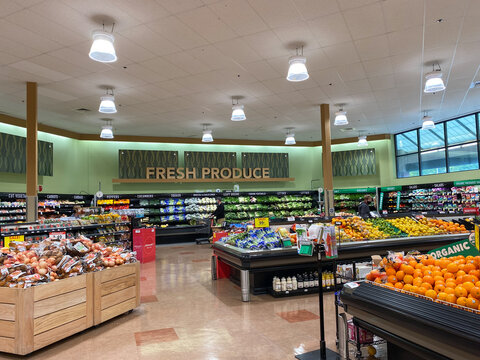 The fresh produce aisle of a Schnucks grocery store with colorful fresh fruits and vegetables ready to be purchased by consumers.