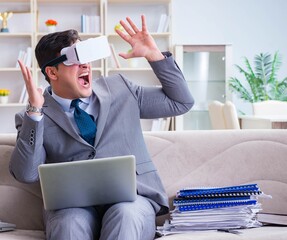 Businessman with virtual reality glasses in modern technology co