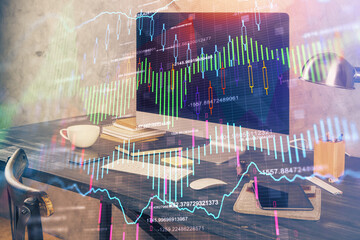 Double exposure of chart and financial info and work space with computer background. Concept of international online trading.