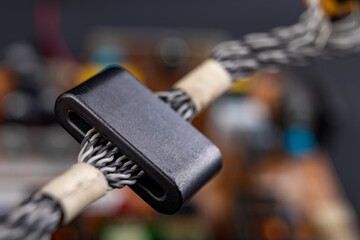 Magnet on several electric wires. Ferrite filter to protect the electrical device.