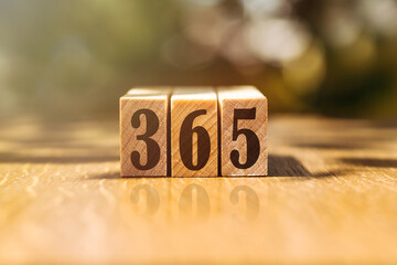 wooden cubes with letters of the 365 - obrazy, fototapety, plakaty