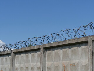 high fence with barbed wire restricted area concept