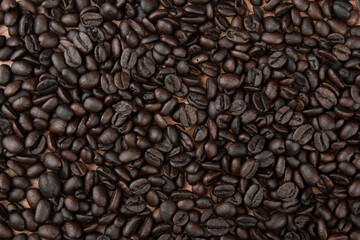 Roasted coffee beans. Detail view of the texture.