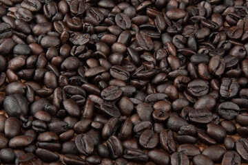 Roasted coffee beans. Detail view of the texture.
