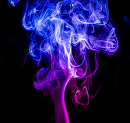 Colored smoke on black background