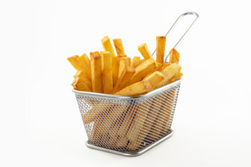 French fries in a metal basket on a white kitchen table