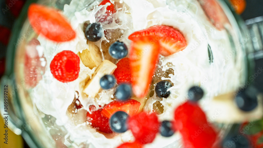 Wall mural berries fresh smoothie blended in blender, top view. healthy eating concept.