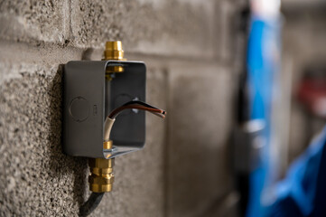 Isolated metal box socket outer case on garage wall ready to be wired