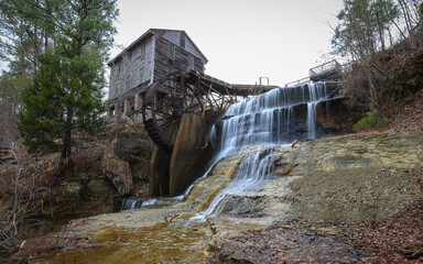 ENTERPRISE, MISSISSIPPI, UNITED STATES - Apr 30, 2018: Dunn's Falls Park waterfall and building