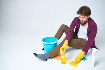 cleaner lying on the floor with a bucket of detergent cleaning service rendering Professional