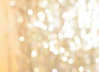 Fototapeta na wymiar golden backdrop, christmas bokeh lights. abstract refocused blurred background.
