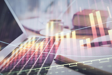 Double exposure of financial chart drawing and desktop with coffee and items on table background. Concept of forex market trading