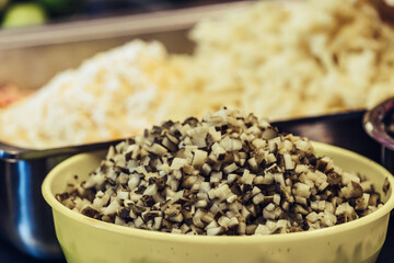 Chopped Ingredients for Salads in Metal Container and Bowl on the Table