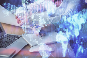 Double exposure of forex chart drawing over people taking notes background. Concept of financial analysis