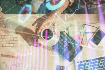 Double exposure of man and woman working together and financial chart hologram drawing. market analysis concept. Computer background. Top View.