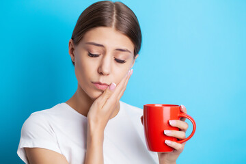 Woman experiencing severe toothache holding her hand over her cheek