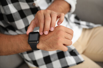 Man with modern smart watch device, closeup