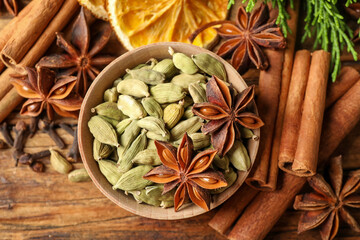 Flat lay composition with mulled wine ingredients on wooden table