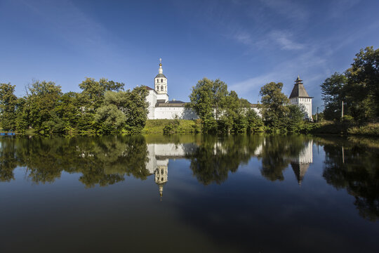 Beautiful view of St. Pafnutiev Borovsky Monastery in Russia with a reflection on a lake water