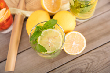 Summer mint lemon tea with a fan and cut lemon fruit