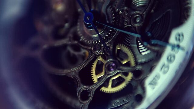 Internal structure, gear mechanism inside a beautiful expensive skeleton wristwatch. Closeup. Macro. Shallow depth of field