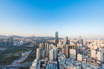 Fototapeta na wymiar The high-rise skyline scenery of Luohu and Nanshan in the evening in Shenzhen, China