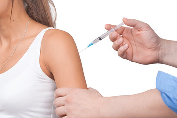 Doctor gives a syringe with vaccine to patient at clinic.