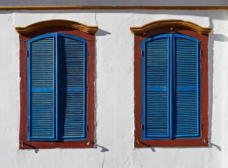 Ancient colonial windows in historical city of Ouro Preto, Brazil 