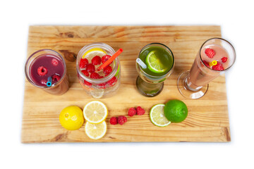 A serving platter with four drinks and smoothies lined up using food-grade, silicone straws that are reusable, and a plastic alternative to be sustainable